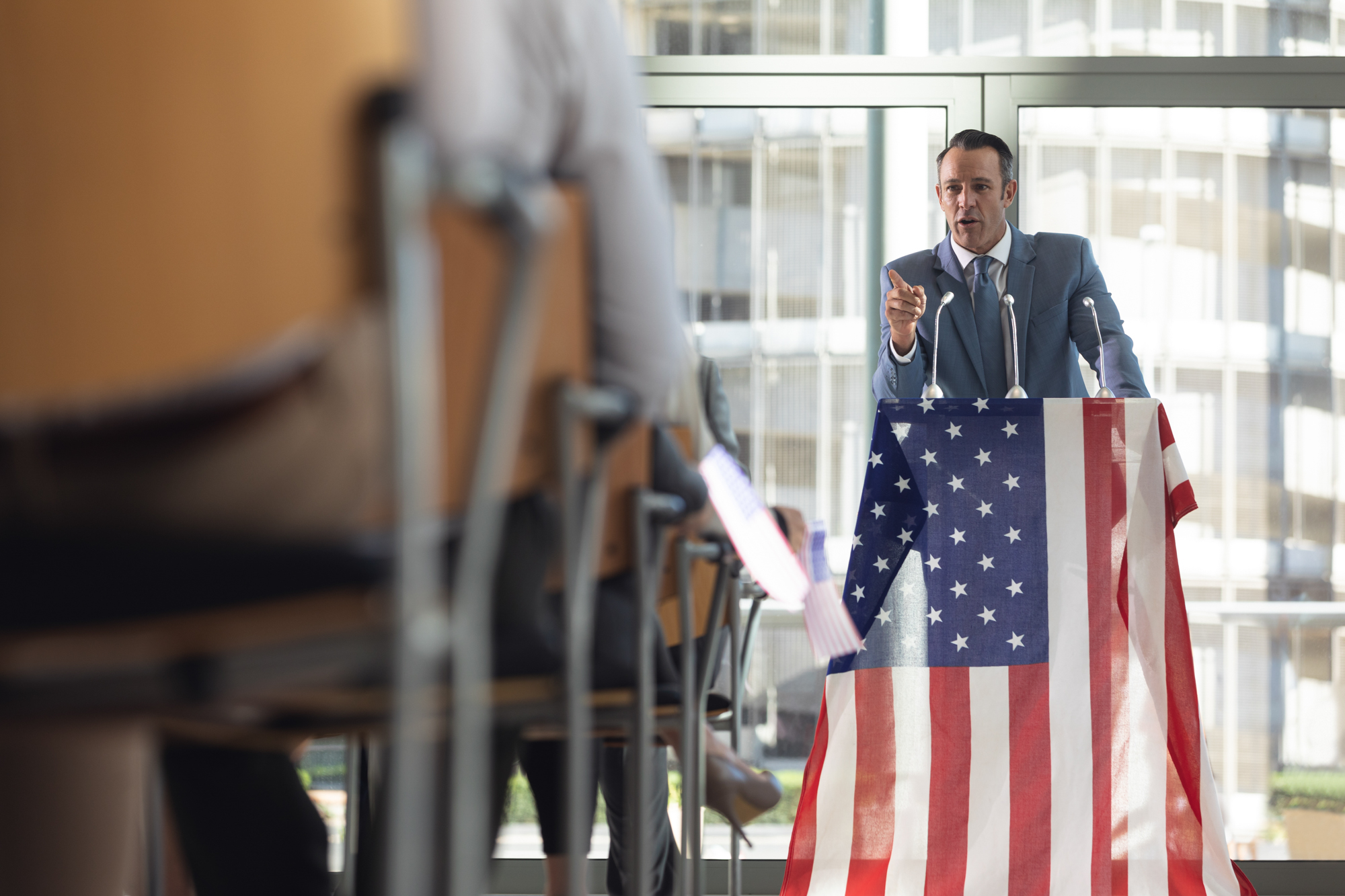 Mature Caucasian businessman speaking in conference room during